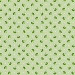 Pattern of small green broccoli on a light green background with white polka dots